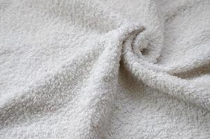 bianca naturale cotone asciugamano sfondo struttura con molti pieghe foto