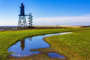 nero faro Torre obererversand nel Wadden mare paesaggio nel dorum Germania. foto