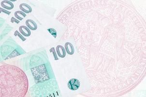 100 ceco korun fatture bugie nel pila su sfondo di grande semi trasparente banconota. astratto attività commerciale sfondo foto