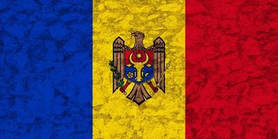 bandiera e cappotto di braccia di moldova su un' strutturato sfondo. concetto collage. foto