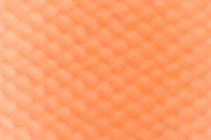 modello maglia arancia astratto sfondo. sfocatura messa a fuoco foto