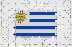 Uruguay bandiera nel telaio di bianca puzzle pezzi con mancante centrale parte foto