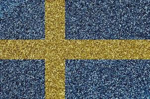 Svezia bandiera raffigurato su molti piccolo brillante paillettes. colorato Festival sfondo per festa foto
