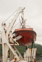 salvare arancia barca per emergenza a mare, marittimo trasporto tema foto