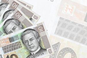 10 croato kuna fatture bugie nel pila su sfondo di grande semi trasparente banconota. astratto attività commerciale sfondo foto