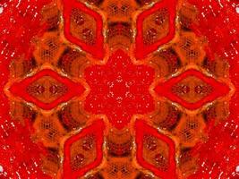 colorato rosso fuoco caleidoscopio sfondo astratto fiore e simmetrico modello foto