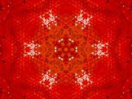 colorato rosso fuoco caleidoscopio sfondo astratto fiore e simmetrico modello foto