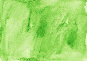 acquerello leggero verde sfondo struttura. aquarelle kelly verde colore sfondo. macchie su carta foto
