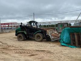 idraulico frantoio, industriale scavatrice macchinari Lavorando su costruzione luogo demolizione foto