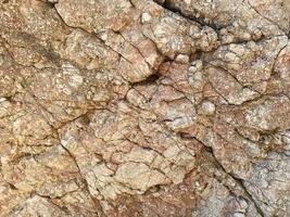 struttura di pietra naturale roccia giallo sfondo con crepe foto