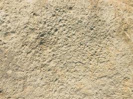 pietra struttura a partire dal naturale, naturale Materiale. grigio sfondo, tridimensionale, con crepe. compressa sabbia con fori foto