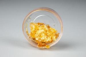arancia d'oro estratto canapa tamponare nel un' bottiglia, cera con alto THC foto