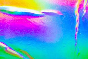 spiegazzato olografico arcobaleno Foglio iridescente struttura astratto ologramma sfondo foto