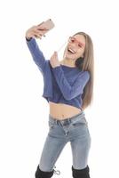 bellezza divertente adolescenziale ragazza fabbricazione autoscatto con sua cellulare foto