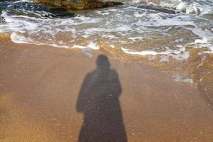 del fotografo ombra su il spiaggia. foto