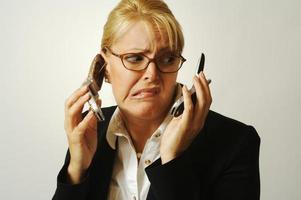 frustrato cellula Telefono donna d'affari. foto