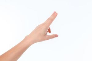 mano mostrando il gesto con un' raschiare ogni altro il tuo indice e mezzo dito foto