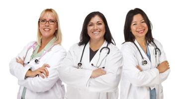 tre femmina medici o infermieri su bianca foto