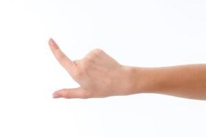 femmina mano mostrando il gesto con sollevato indice su isolato su bianca sfondo foto