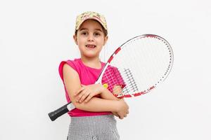 poco ragazza con un' tennis racchetta foto