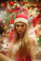 divertente Natale bionda ragazza nel Santa cappello foto