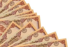 10 nepalese rupie fatture bugie isolato su bianca sfondo con copia spazio impilati nel fan vicino su foto