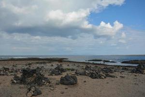 baia pieno di vulcanico pietre nel bajo balena. EL cotillo la oliva Fuerteventura canarino isole. foto