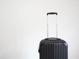 bagaglio nero colore su bianca isolato vacanza concetto foto