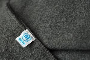 kiev, Ucraina - Maggio 4, 2022 L'UNHCR il un profugo agenzia logo su umanitario grigio coperte foto