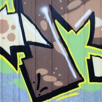 frammento di graffiti disegni. il vecchio parete decorato con dipingere macchie nel il stile di strada arte cultura. colorato sfondo struttura foto