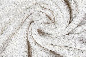 bianca macro foto di strutturato maglia e maglieria di maglione o felpa. modello e sfondo per moda caldo autunno concetto