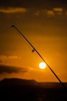 pesca polo al di sopra di il tramonto foto