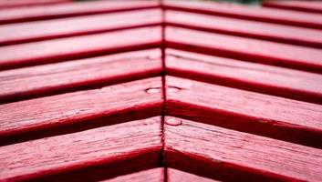 struttura di legno tavole dipinto rosso dipingere avvicinamento foto