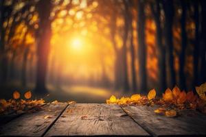 autunno tavolo - arancia le foglie e di legno tavola a tramonto nel sfocato foresta foto