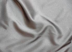 liscio elegante nero seta tessuto o raso lusso stoffa struttura per astratto sfondo foto