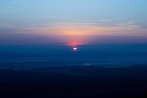 sole al tramonto rosa foto