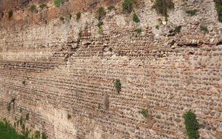 industriale stile antico rosso mattone e pietra parete sfondo foto