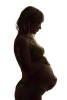 silhouette di un' incinta giovane donna. isolato foto