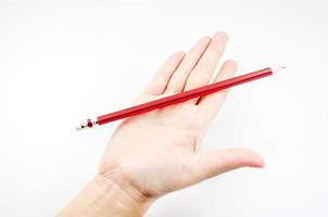 rosso matita su mano donna su bianca sfondo foto