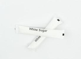 bustine di zucchero bianco foto