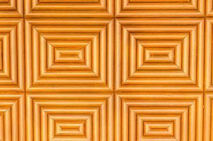 sfondo arancione geometrico del pannello di legno foto