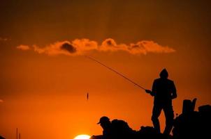 sagoma di canna da pesca pescatore foto