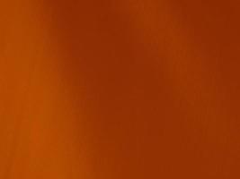 arancia velluto tessuto struttura Usato come sfondo. tono colore arancia stoffa sfondo di morbido e liscio tessile Materiale. Là è spazio per testo e per tutti tipi di design opera. foto