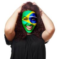 ragazza con brasiliano bandiera viso dipingere foto