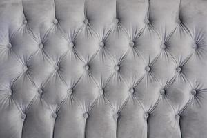 dettaglio del divano in velluto grigio per texture o sfondo