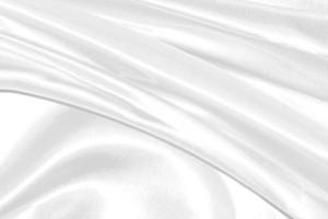 avvicinamento elegante spiegazzato di bianca seta tessuto stoffa sfondo e struttura foto