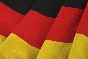 Germania bandiera con grande pieghe agitando vicino su sotto il studio leggero al chiuso. il ufficiale simboli e colori nel bandiera foto