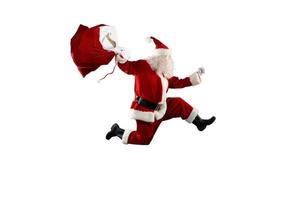 Santa Claus corre veloce per consegnare tutti i regali per Natale foto