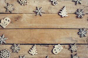 di legno Marrone Natale sfondo con i fiocchi di neve e Natale decorazione. foto