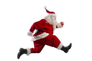 Santa Claus corre veloce per consegnare per Natale vigilia foto